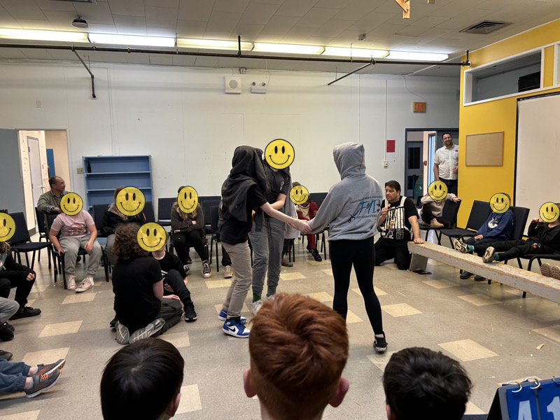 Students performing at the school